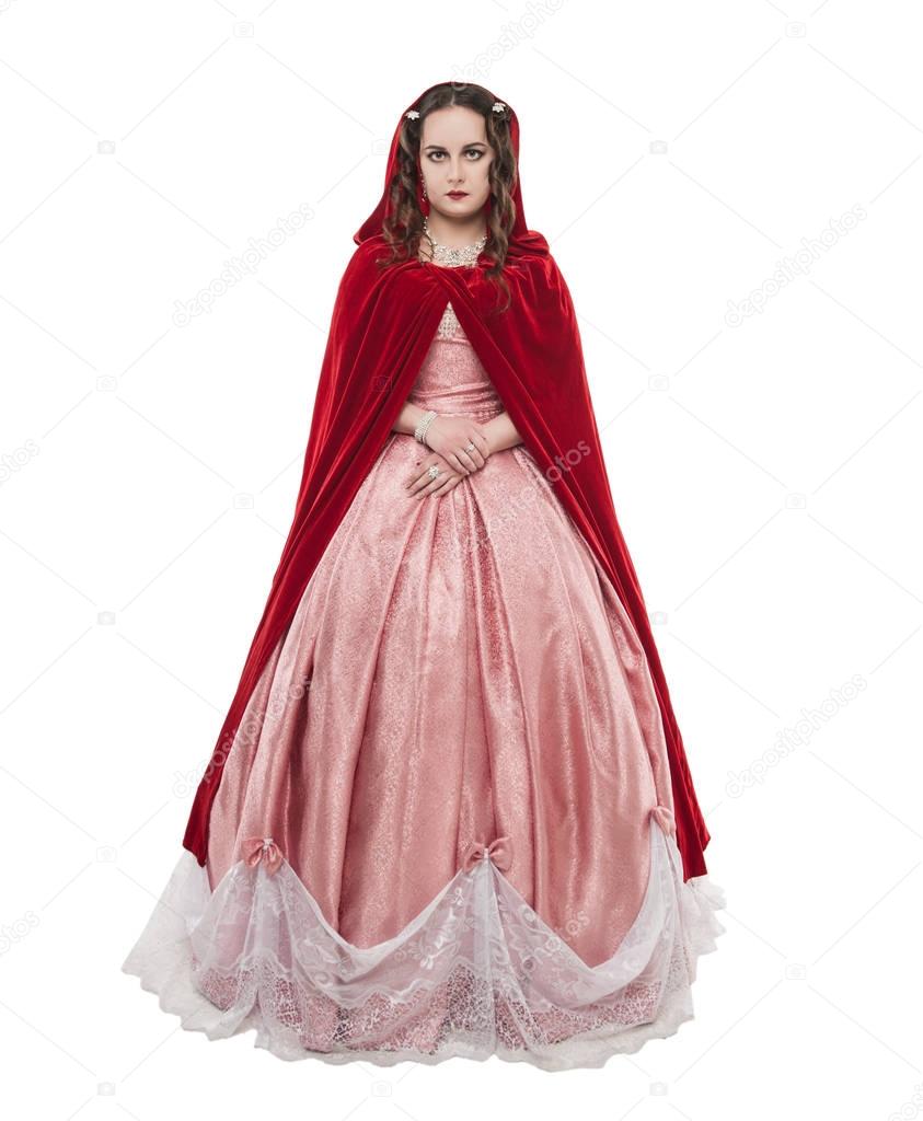 Young beautiful woman in long medieval dress and red cloak isola