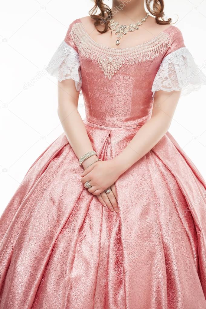 Beautiful woman in old historic medieval dress on white 