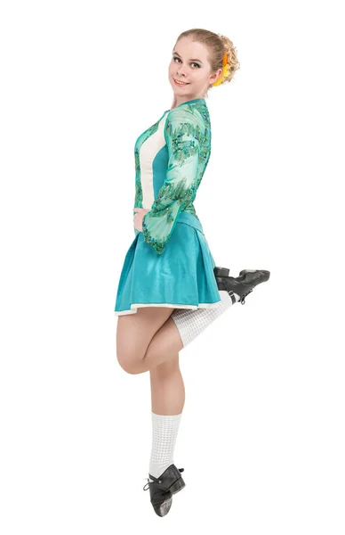 Beautiful woman in blue dress for Irish dance jumping isolated — Stock Photo, Image