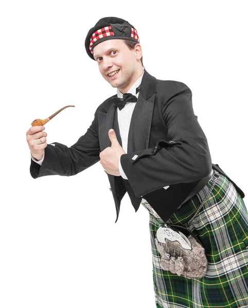 Hombre escocés en traje nacional tradicional con pipa de fumar — Foto de Stock