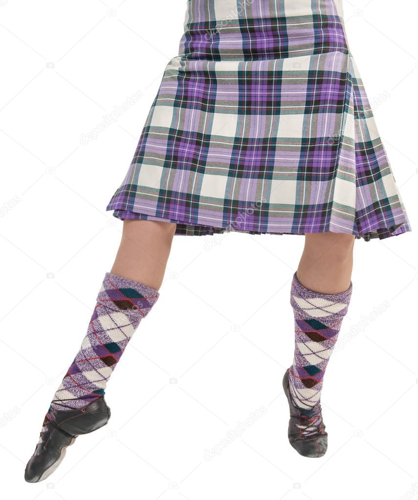 Legs of Scottish woman in traditional national costume