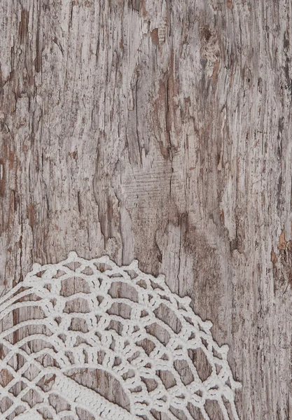 Vintage lace fabric border on the old wood — Stock Photo, Image