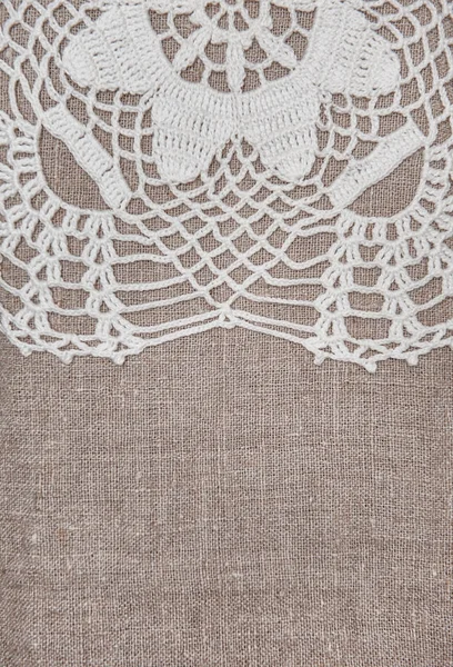 Borda de tecido de renda vintage no antigo tecido de serapilheira — Fotografia de Stock