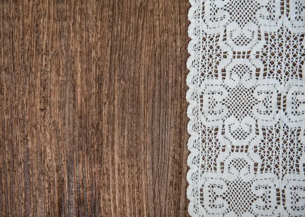 Vintage background with lace on the old wood — Stock Photo, Image