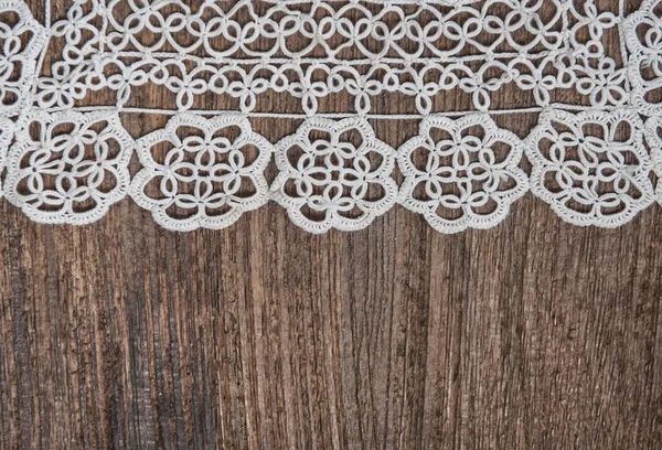 Vintage background with lace on the old wood — Stock Photo, Image