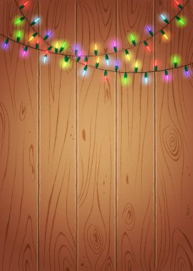 Ahşap arka plan üzerinde parlak renkli ışıklar