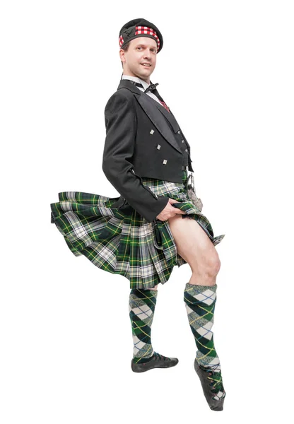 Шотландец в традиционном национальном костюме с дующим килтом — стоковое фото