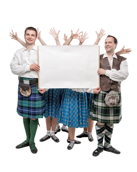 Group of dancers of Scottish dance with empty banner — Stock Photo, Image