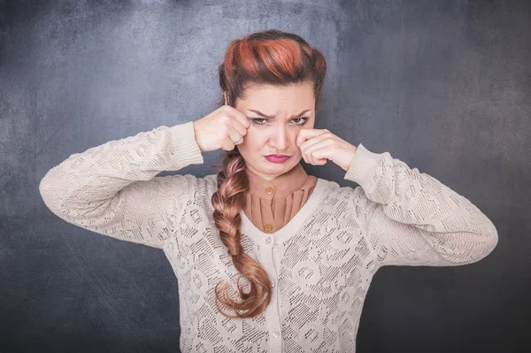 Sad crying woman on the chalkboard background — Stock Photo, Image