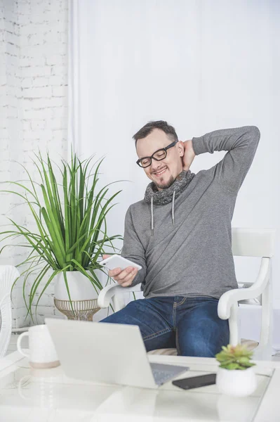 Handsome happy man working using laptop and relax at home — Stock Photo, Image