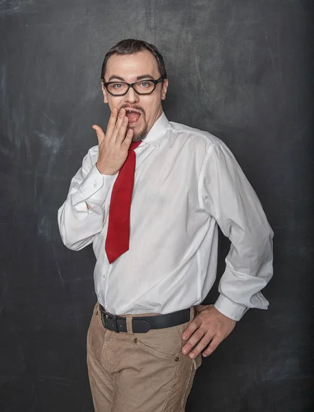 Surprised Funny teacher or business man on blackboard background