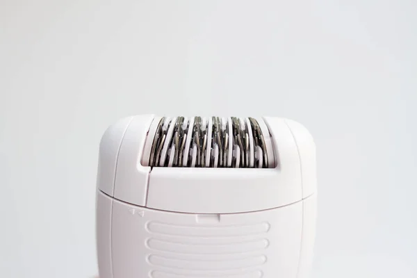 Electric epilator for hair removal on a white background, close-up — Stock Photo, Image