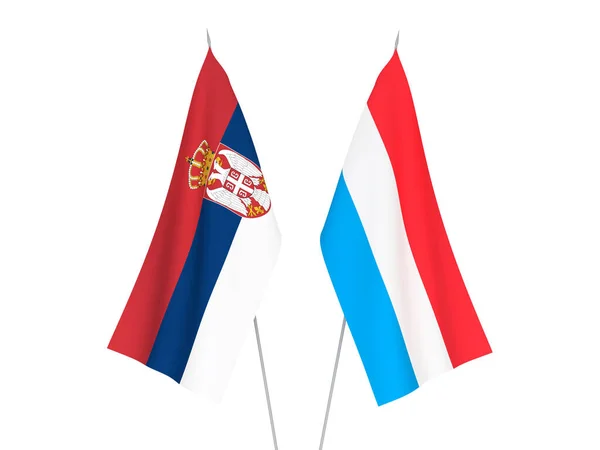 Прапори Люксембургу та Сербії — стокове фото
