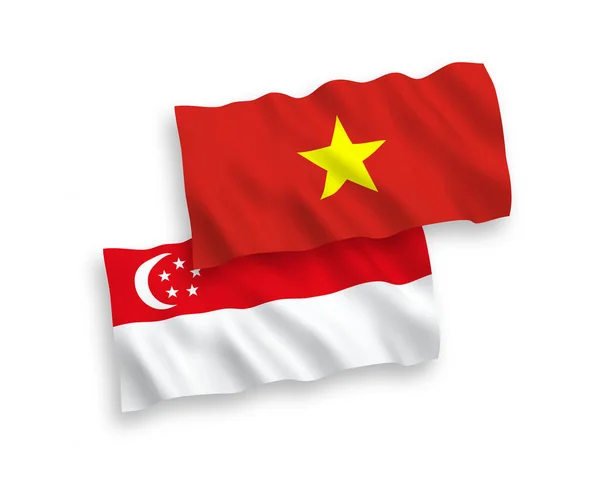 Flags of Vietnam and Singapore on a white background — ストックベクタ