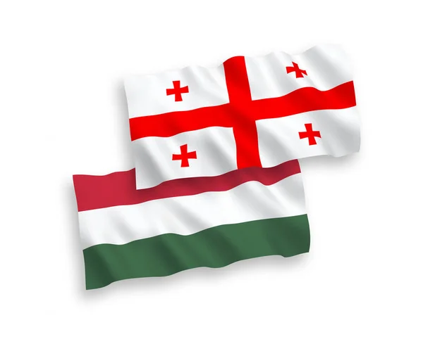 Vlajky Gruzie a Maďarska na bílém pozadí — Stockový vektor