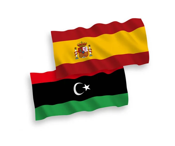 Прапори Лівії та Іспанії на білому тлі — стоковий вектор