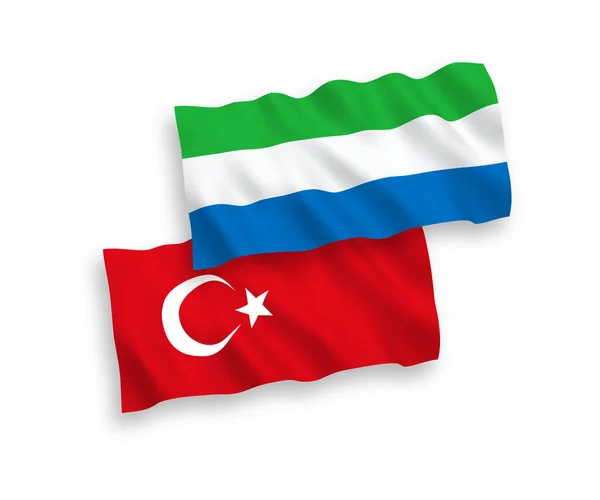 Flaggen der Türkei und Sierra Leone auf weißem Hintergrund — Stockvektor