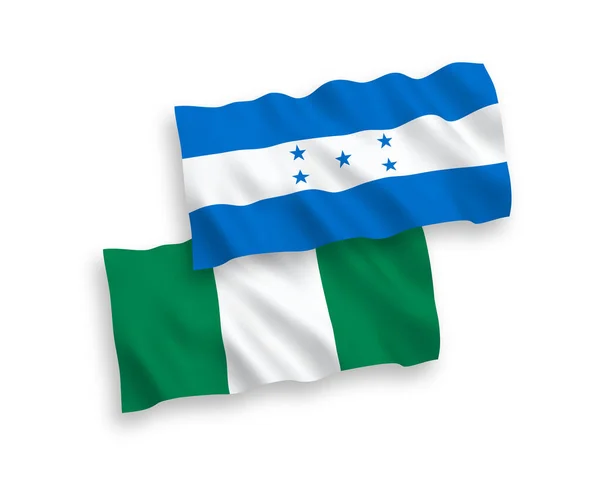 白色背景下的尼日利亚和洪都拉斯国旗 — 图库矢量图片