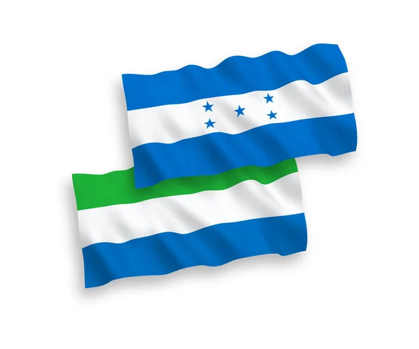 Banderas de Sierra Leona y Honduras sobre fondo blanco — Vector de stock