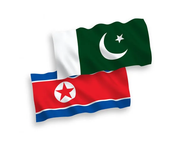 Flaggor i Nordkorea och Pakistan på en vit bakgrund — Stock vektor