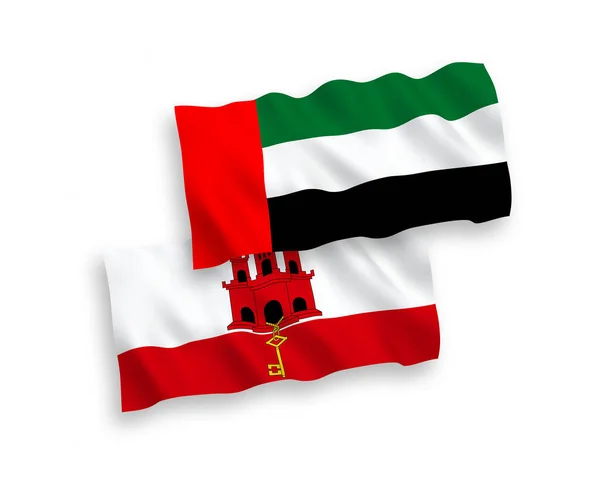 阿拉伯联合酋长国和直布罗陀在白色背景下相互隔离的国家病媒织物波浪旗 1比2的比例 — 图库矢量图片