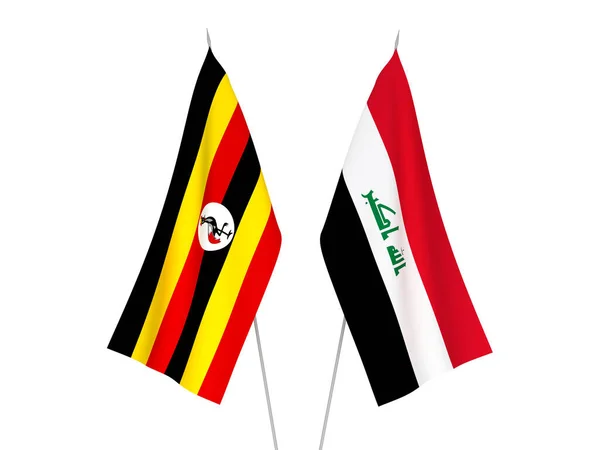 National fabric flags of Uganda and Iraq isolated on white background. 3d rendering illustration.