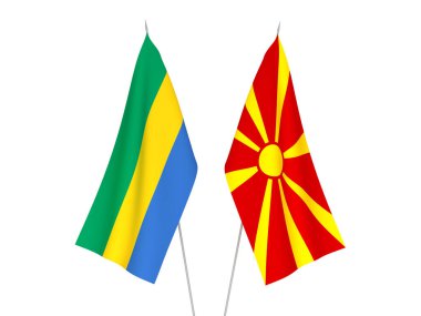 Kuzey Makedonya ve Gabon 'un ulusal kumaş bayrakları beyaz arka planda izole edildi. 3d resimleme.