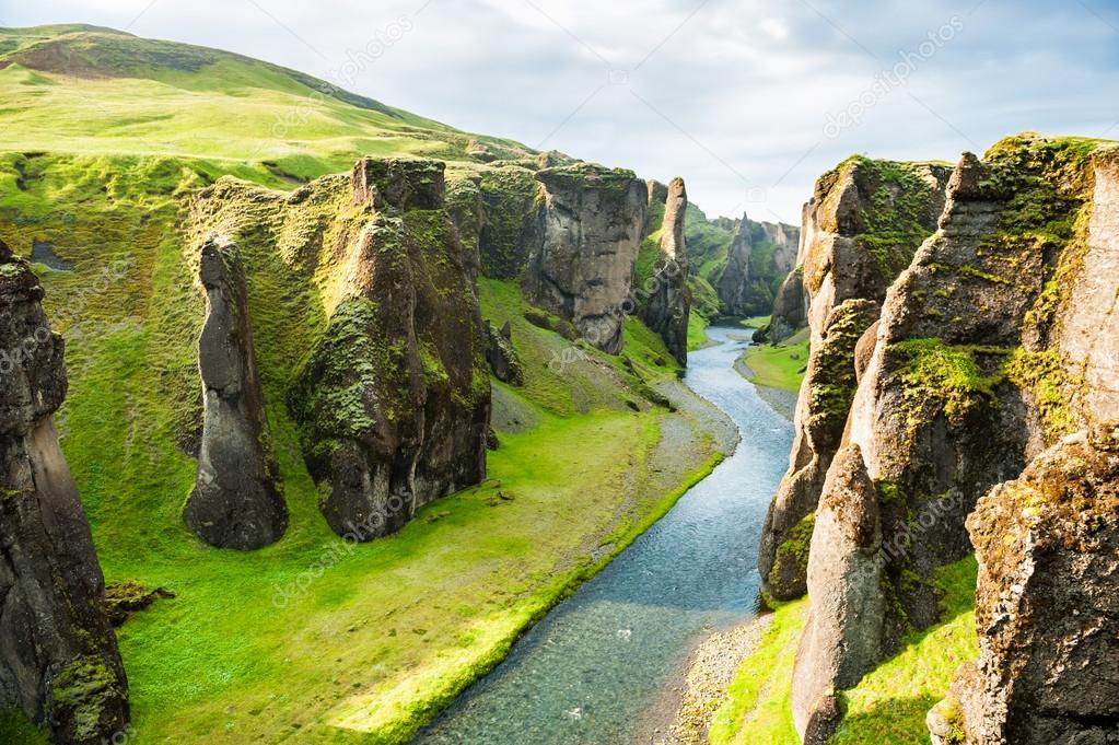 Fjadrargljufur canyon with river and big rocks. 