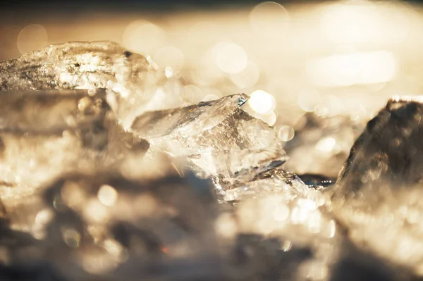 Ice on the frozen lake at sunset. — Stock Photo, Image