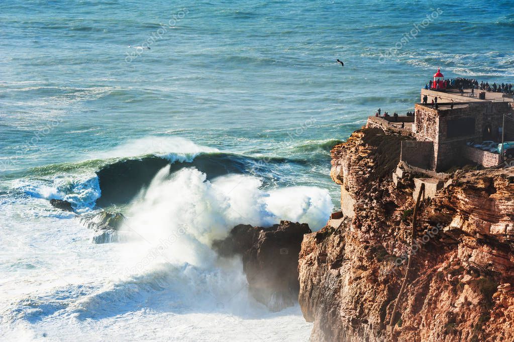 Lighthouse on the coast of Atlantic ocean in Nazare, Portugal.