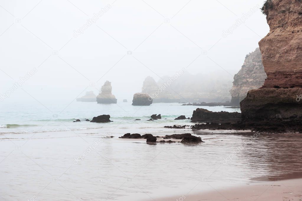 Rocks on the shore of Atlantic ocean in Algarve, Portugal