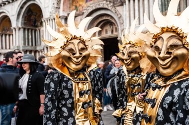 Venice, Italy - Februrary, 15, 2020: People wearing carnival masks at traditional Venice Carnival, San Marco square