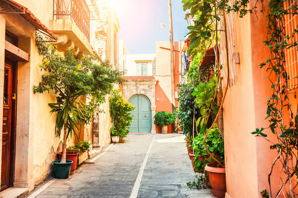 Beautiful street with old architecture and green plants in Chania, Crete island, Greece.