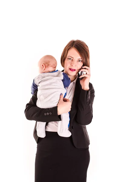 Young working mom carrying her baby in one hand isolated — Stock Photo, Image