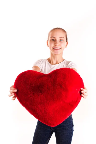 Cute little girl holding red heart isolated — Stock Photo, Image