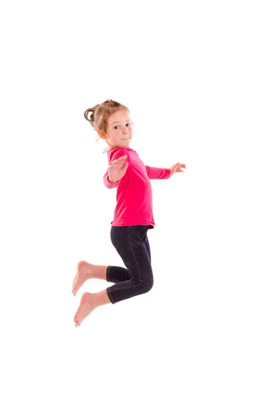 Active happy little girl jumping — Stock Photo, Image