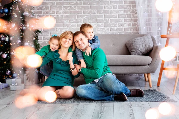 Happy family having fun together near Christmas tree — Stock Photo, Image