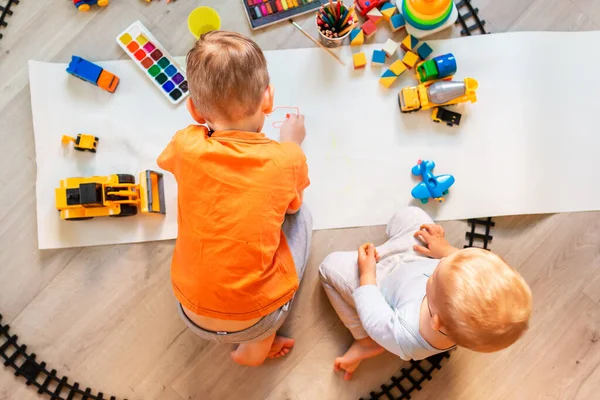 Preschool Boys Drawing Floor Paper Playing Educational Toys Blocks Train — Stock Photo, Image