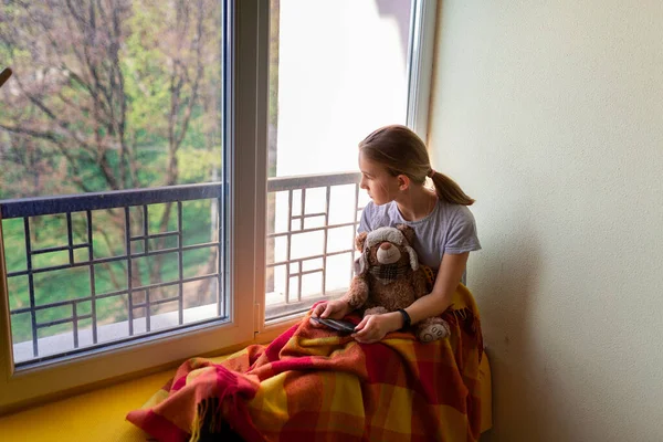 Sad Little Girl Sitting Window Toy Home Isolated Watching Out — Stock Photo, Image