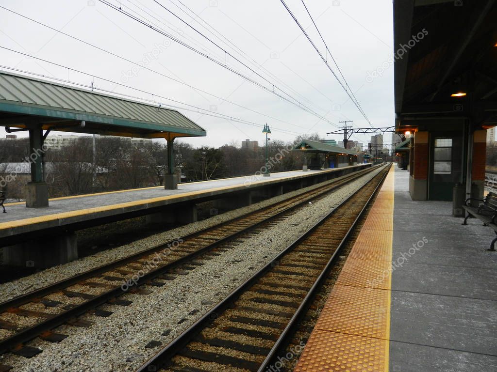 Empty station perspective on cloudy day