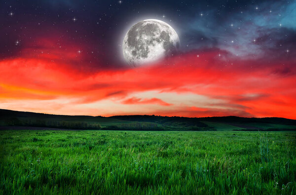 View on orange night sky background. Elements of this image furnished by NASA