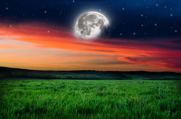 View on orange night sky background. Elements of this image furnished by NASA