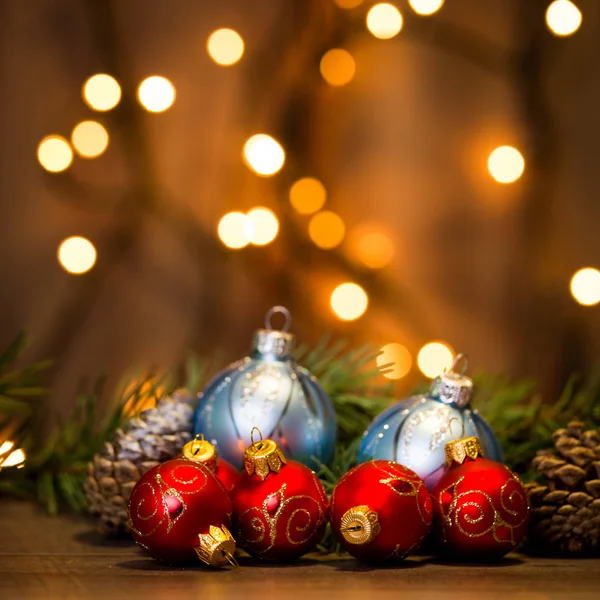 Colored Christmas balls with pine branches — Stock Photo, Image