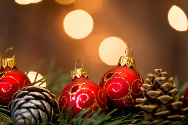 Three Christmas balls with pine branches — Stock Photo, Image