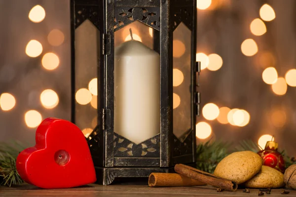Christmas candle lamp on wooden table