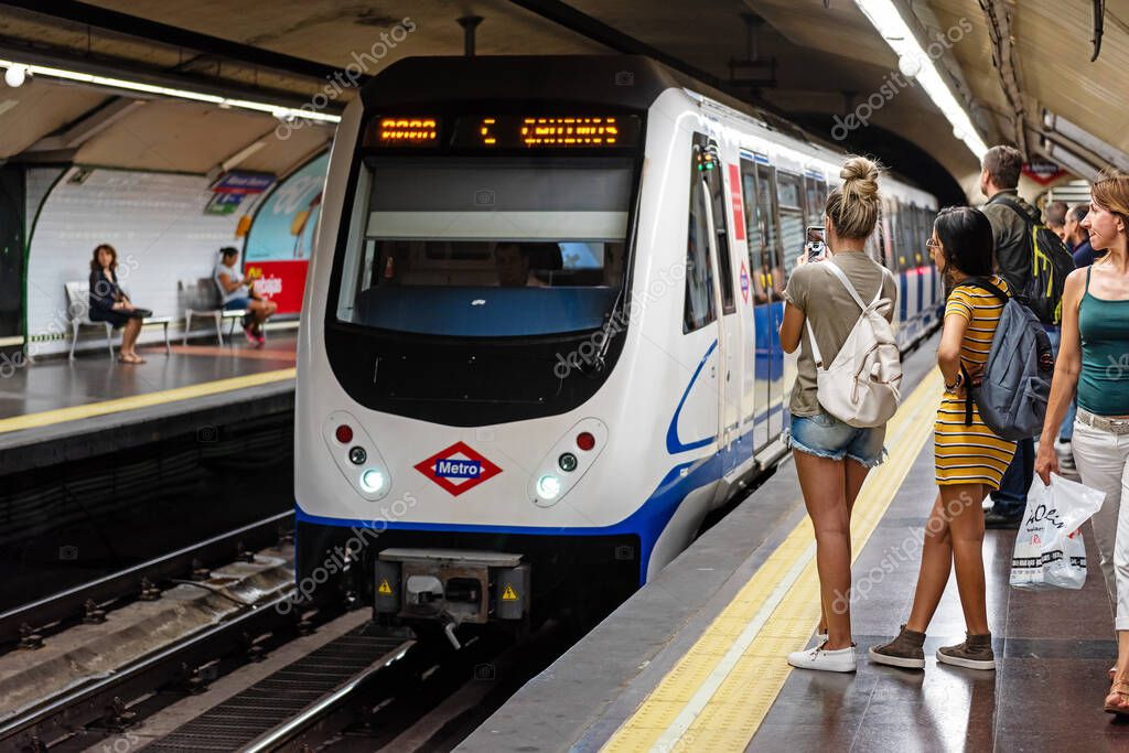 Madrid, Spain - 19 July 2018: Madrid metro. People waiting a train on platform