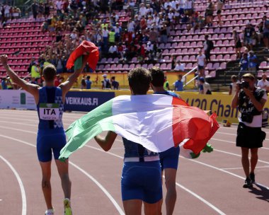 Tampere, Finlandiya, 15 Temmuz: İtalya röle takımı, 15 Temmuz 2018 'de Finlandiya' nın Tampere kentinde düzenlenen Dünya U20 Şampiyonası 'nda 4x400 metre bayrak yarışı kazandı..