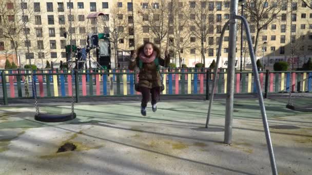 Little girl with down syndrome having fun on the swing — 비디오