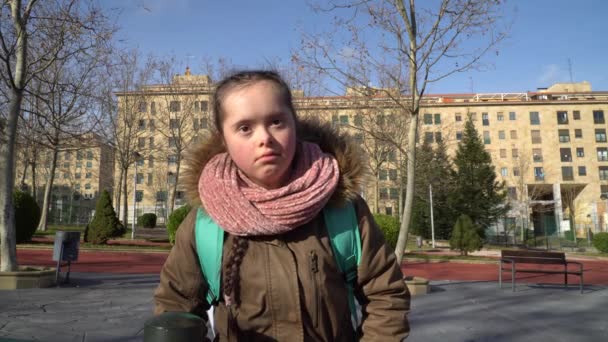 Girl with down syndrome walking outside — Stock Video