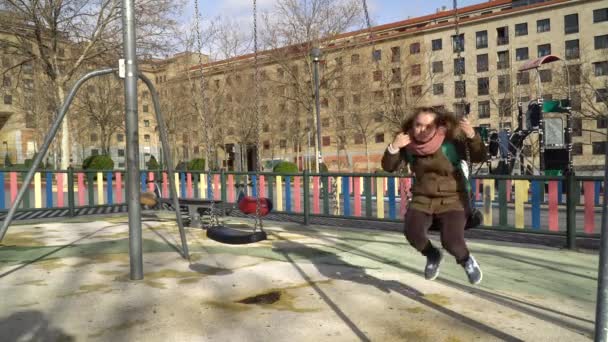 Little girl with down syndrome having fun on the swing — 비디오